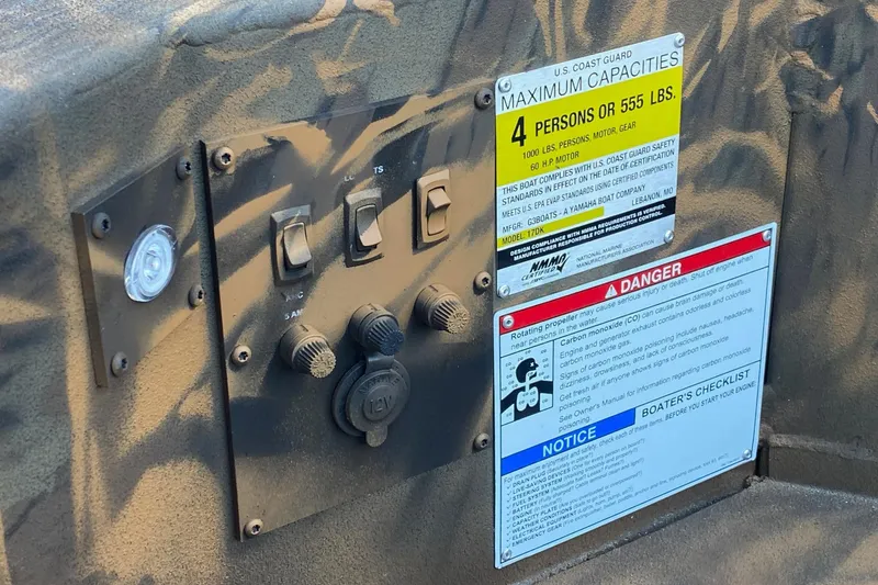 Slide: The Image of Control panel of 2026 G3 Gator Tough 17 DK boat with safety and capacity labels. - 8