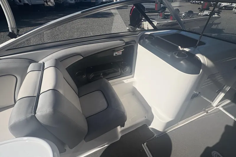 Slide: The Image of 2012 Yamaha Boats AR240 HO interior with seating and storage compartments. - 11