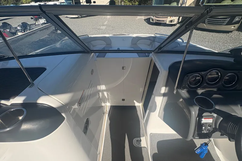 Slide: The Image of 2012 Yamaha Boats AR240 HO interior with dashboard and seating area. - 16