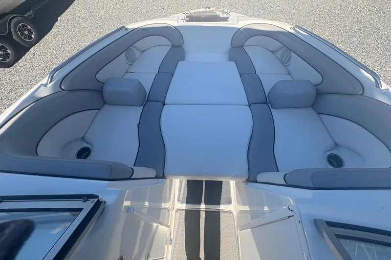 Slide: The Image of 2012 Yamaha Boats AR240 HO interior seating with gray and white upholstery. - 17