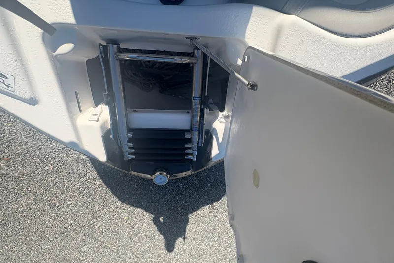 Slide: The Image of Yamaha AR240 HO 2012 boat ladder compartment open, showing retractable ladder. - 18