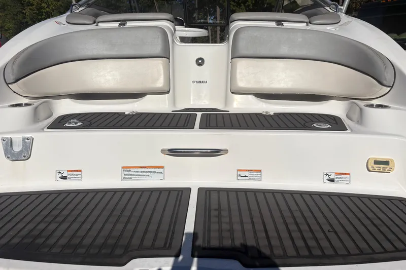 Slide: The Image of 2012 Yamaha Boats AR240 HO swim platform with cushioned seating and non-slip mats. - 5