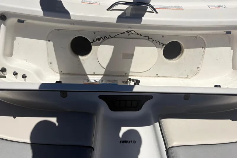 Slide: The Image of 2012 Yamaha Boats AR240 HO interior with storage compartment and seating area. - 6