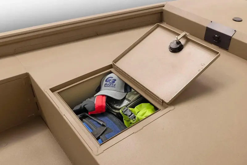 Slide: The Image of Manufacturer Provided Image: Open storage compartment on 2026 G3 Gator Tough 16 DK boat with gear inside. - 11
