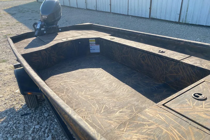 Slide: The Image of 2026 G3 Gator Tough 16 DK boat with camo interior and 40 HP motor. - 6