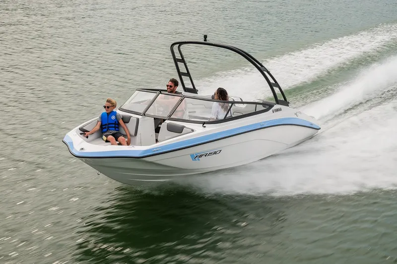 Slide: The Image of Manufacturer Provided Image: 2026 Yamaha Boats AR190 cruising on a scenic river near rocky cliffs. - 11