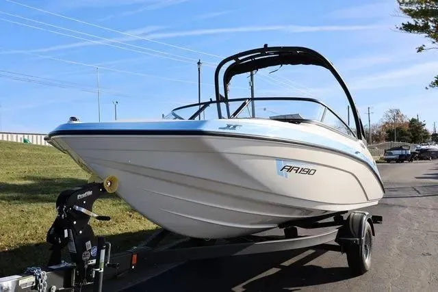 Slide: The Image of 2026 Yamaha Boats AR190 on trailer, sleek design, white and blue accents, outdoor setting. - 3