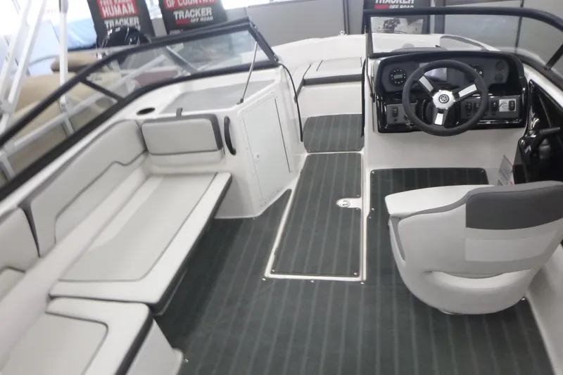 Slide: The Image of 2026 Yamaha Boats AR190 on trailer, sleek design, blue and white color scheme, outdoor setting. - 6