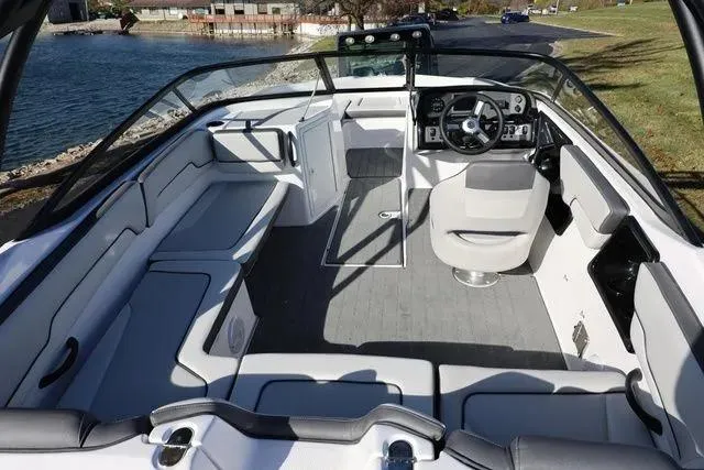 Slide: The Image of 2026 Yamaha Boats AR190 in showroom, sleek design with blue accents. - 9