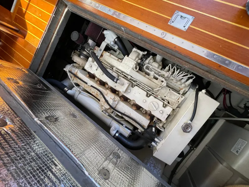 Slide: The Image of 1970 Matthews Flush Deck Cruiser engine compartment with visible mechanical components. - 40