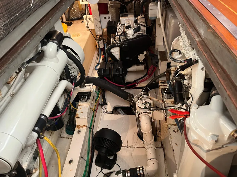 Slide: The Image of Engine room of a 1970 Matthews Flush Deck Cruiser with visible mechanical components. - 43