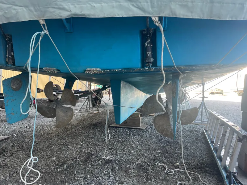 Slide: The Image of 1970 Matthews Flush Deck Cruiser underside with propellers and rudders visible. - 48