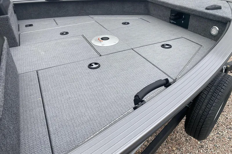 Slide: The Image of 2026 G3 Angler V17 FS boat deck with storage compartments and textured flooring. - 10
