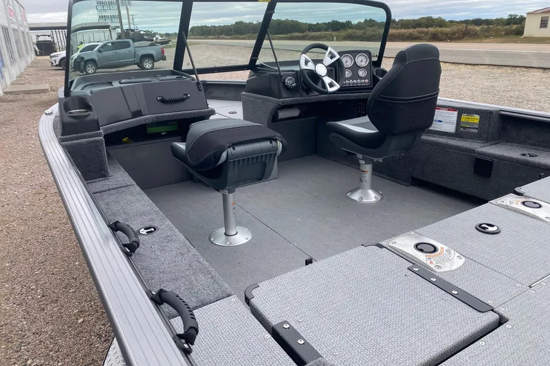 Slide: The Image of 2026 G3 Angler V17 FS boat interior with seating and steering console. - 11