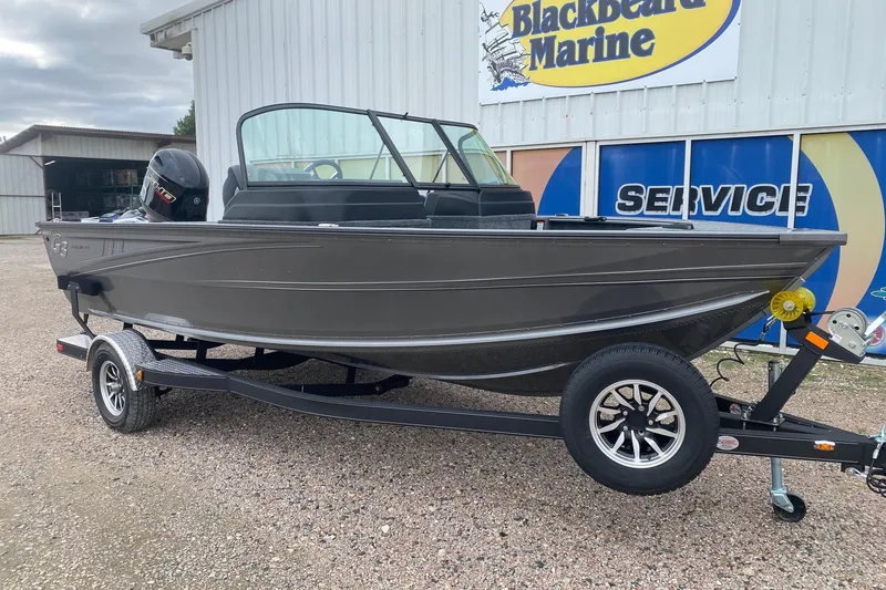 Slide: The Image of 2026 G3 Angler V17 FS boat on trailer at Blackbeard Marine dealership. - 2