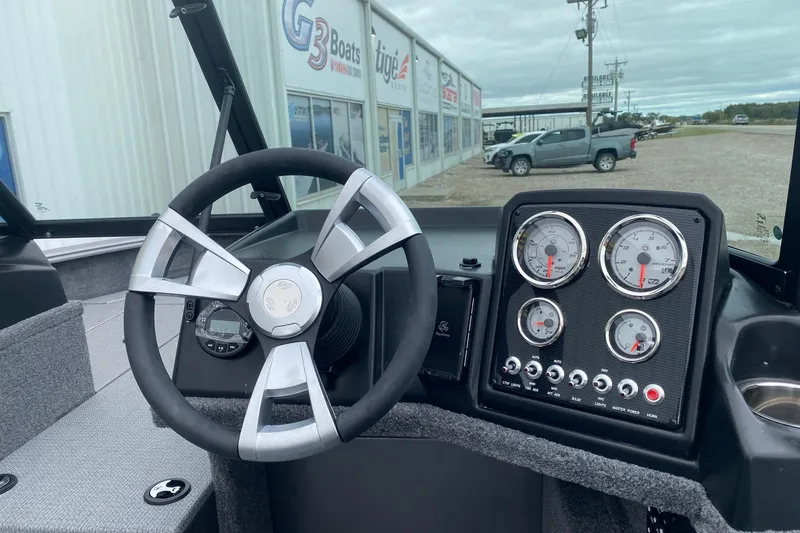 Slide: The Image of 2026 G3 Angler V17 FS boat dashboard with steering wheel and gauges. - 7