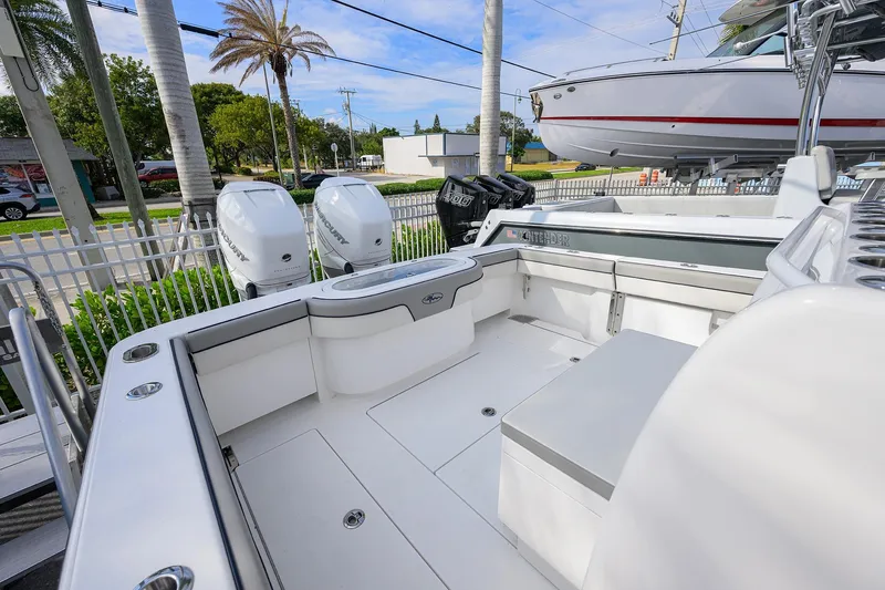 Slide: The Image of 2020 Valhalla V-33 boat interior with seating and dual outboard engines. - 16