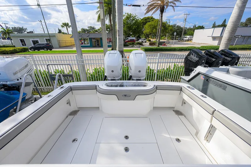 Slide: The Image of Valhalla V-33 boat deck, 2020 model, with dual outboard engines and spacious seating area. - 19