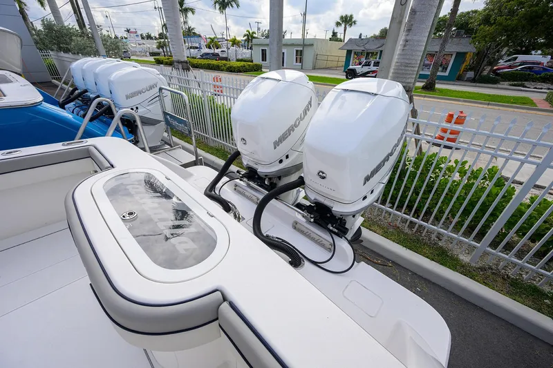 Slide: The Image of Valhalla V-33 boat with dual Mercury outboard engines, 2020 model, docked near a fence. - 22