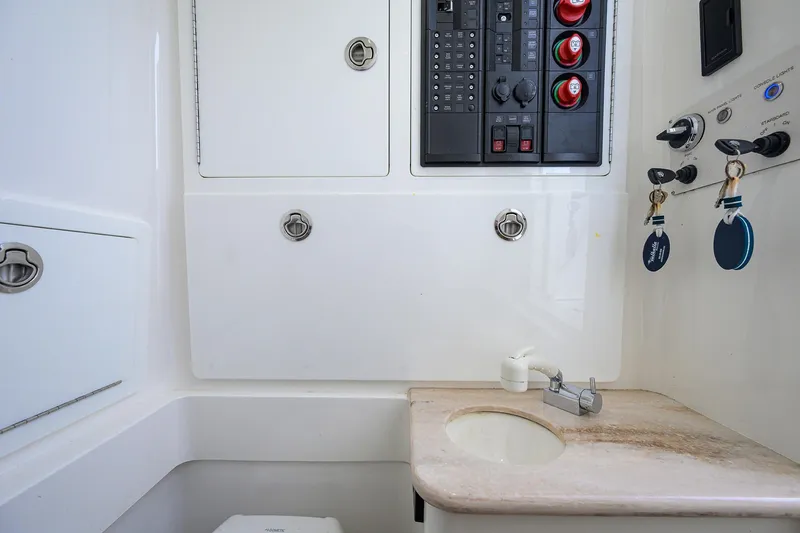 Slide: The Image of 2020 Valhalla V-33 boat interior with control panel and sink area. - 25