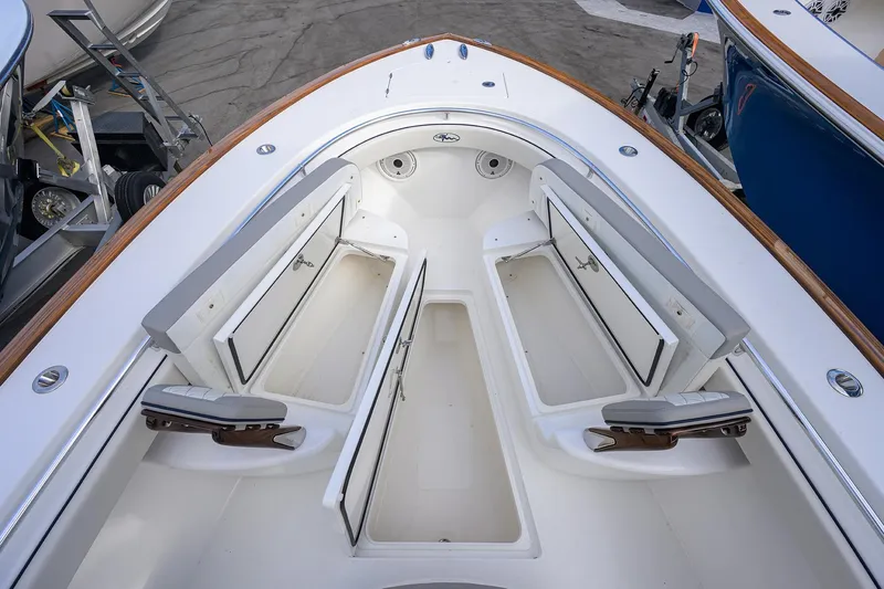 Slide: The Image of 2020 Valhalla V-33 boat interior with open storage compartments and seating. - 9