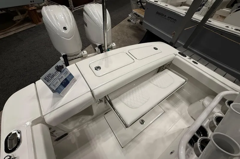 Slide: The Image of 2026 Regulator 23 boat interior with dual engines and seating area. - 20