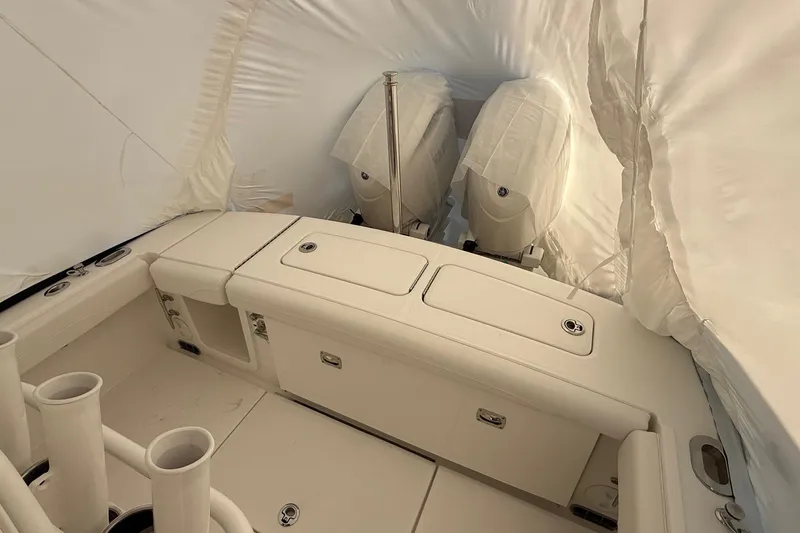 Slide: The Image of 2026 Regulator 23 boat interior with twin engines under protective cover. - 38