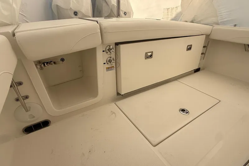 Slide: The Image of 2026 Regulator 23 boat interior with storage compartments and sleek design. - 48