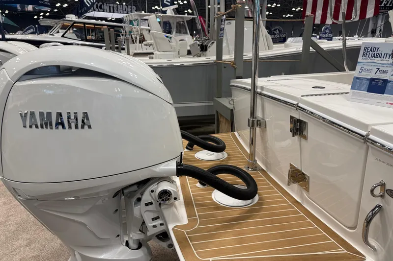 Slide: The Image of 2026 Regulator 23 boat with Yamaha engine, showcased at a boat exhibition. - 5