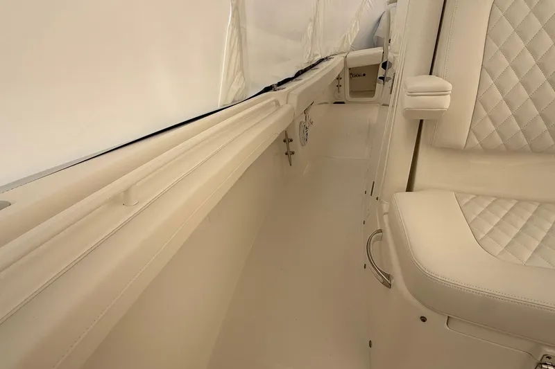 Slide: The Image of 2026 Regulator 23 boat interior with white seating and sleek design. - 51