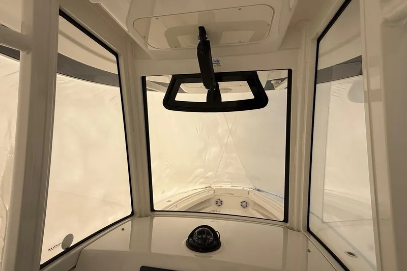 Slide: The Image of Interior view of 2026 Regulator 23 boat cockpit with compass and windows. - 54