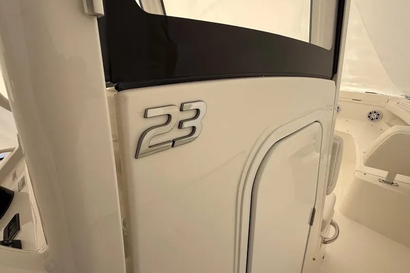 Slide: The Image of 2026 Regulator 23 boat interior with model number displayed. - 56