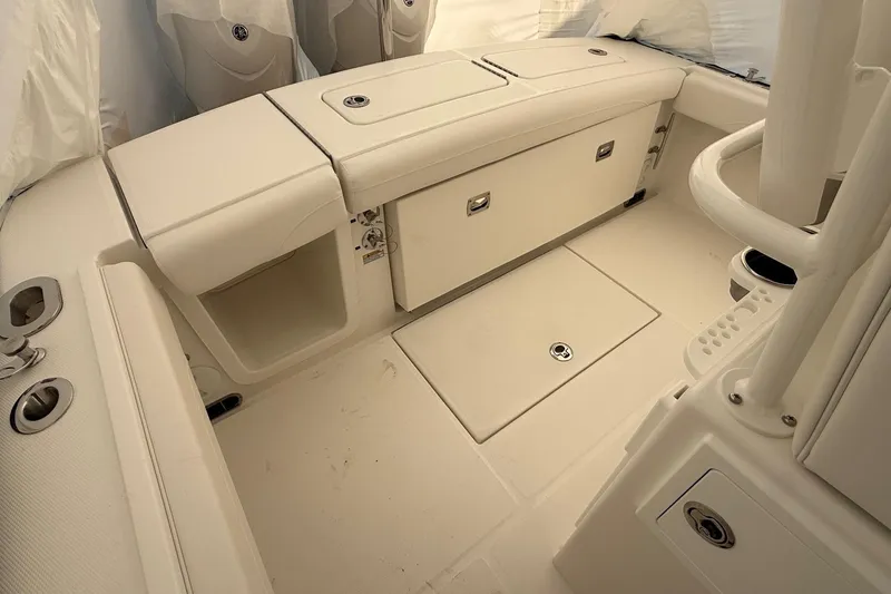 Slide: The Image of 2026 Regulator 23 boat interior with storage compartments and seating. - 61
