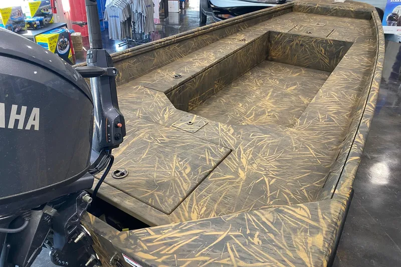 Slide: The Image of 2026 G3 Gator Tough 17 DK boat with camouflage design and Yamaha motor. - 2