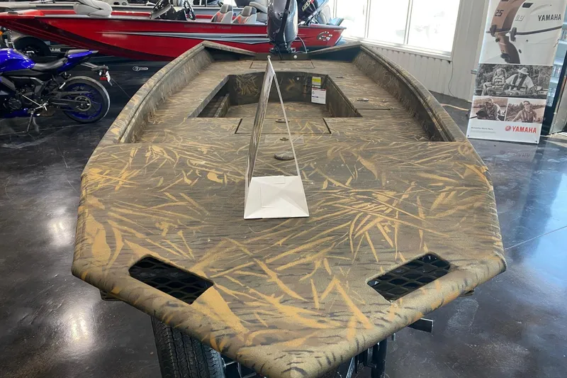 Slide: The Image of 2026 G3 Gator Tough 17 DK boat with camouflage design in showroom. - 5