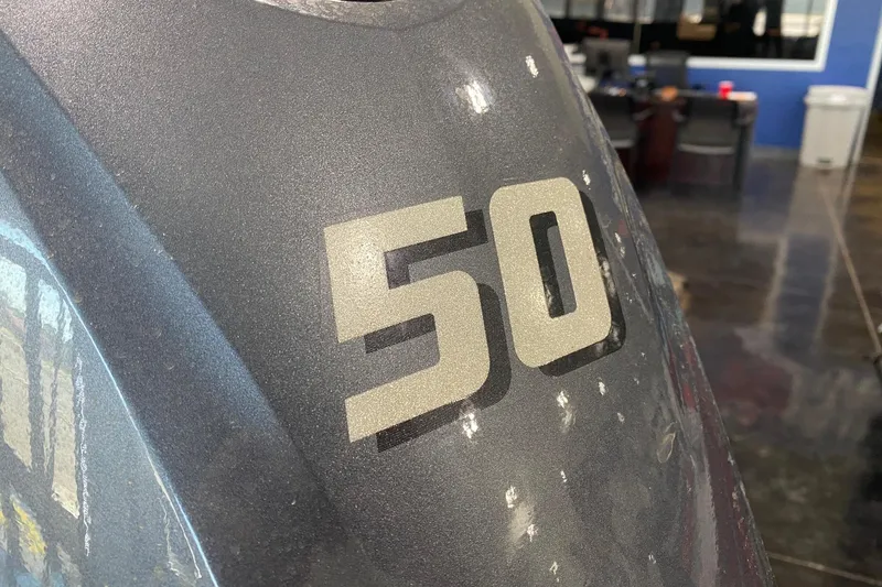 Slide: The Image of Close-up of G3 Gator Tough 17 DK 2026 with '50' decal in showroom. - 8