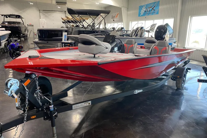 Slide: The Image of 2026 G3 Sportsman 1710 SE, red fishing boat on trailer in showroom. - 2