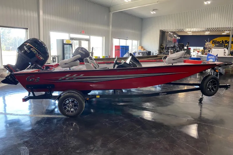 Slide: The Image of 2026 G3 Sportsman 1710 SE boat in showroom, red exterior, Yamaha engine, on trailer. - 4