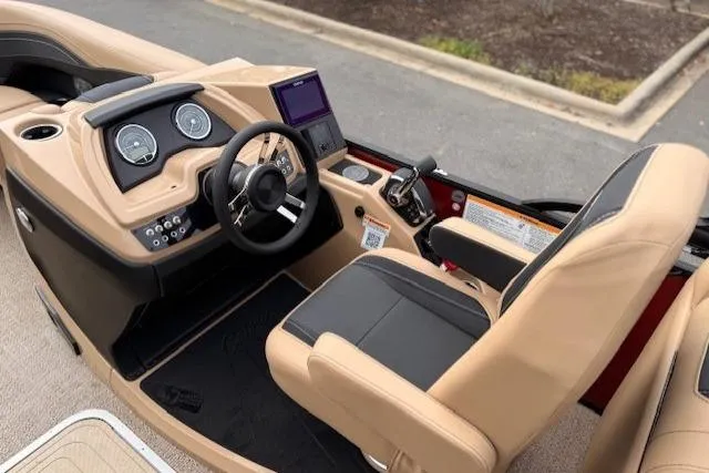 Slide: The Image of Interior of 2026 Barletta C22QC boat with modern dashboard and steering wheel. - 8