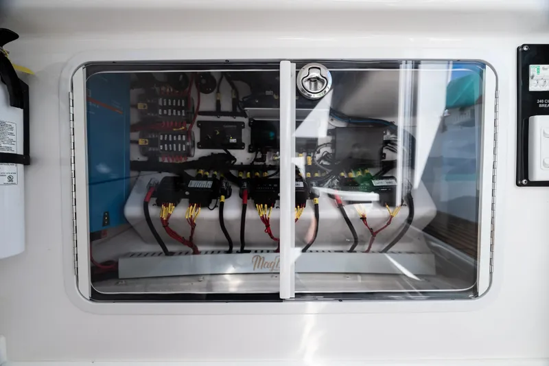 Slide: The Image of Electrical panel of 2019 Mag Bay 33 CC boat with wiring and components. - 32