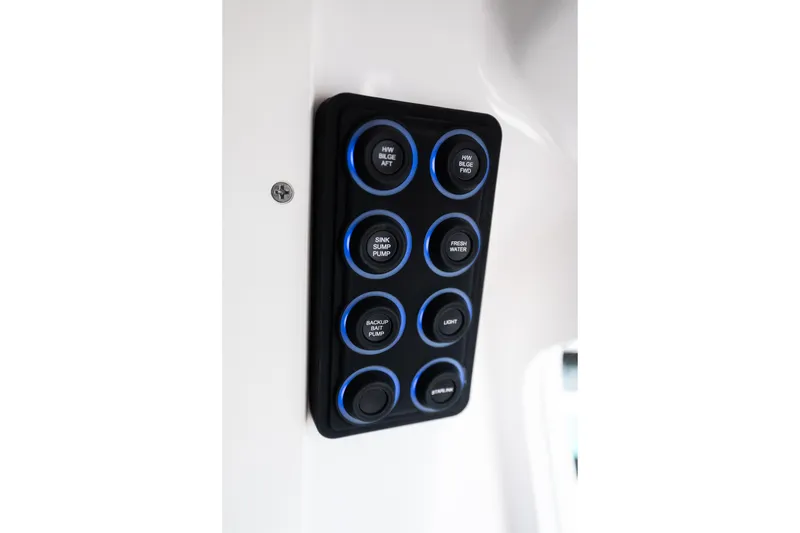 Slide: The Image of Control panel on 2019 Mag Bay 33 CC boat with labeled buttons. - 44