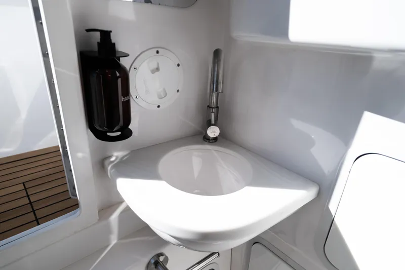 Slide: The Image of 2019 Mag Bay 33 CC boat interior with sink and soap dispenser. - 46
