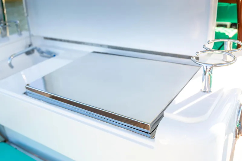 Slide: The Image of 2019 Mag Bay 33 CC boat with sleek stainless steel features and rod holders. - 70