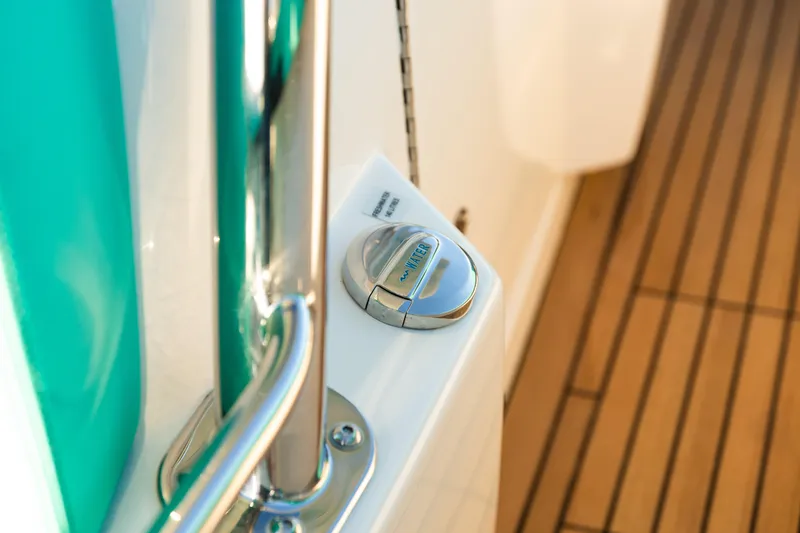 Slide: The Image of Close-up of 2019 Mag Bay 33 CC boat deck with water fill cap. - 76