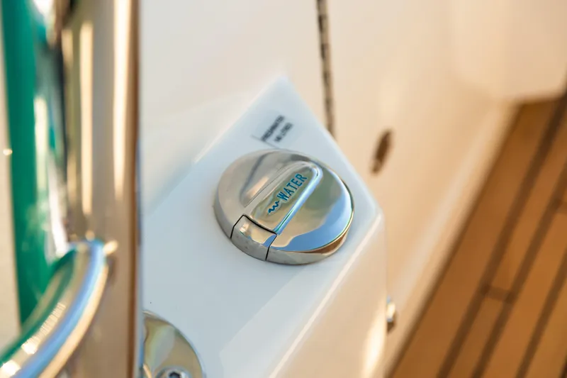 Slide: The Image of Water fill cap on 2019 Mag Bay 33 CC boat deck. - 77