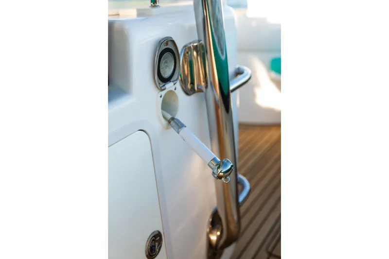 Slide: The Image of 2019 Mag Bay 33 CC boat detail with stainless steel fittings and teak deck. - 80