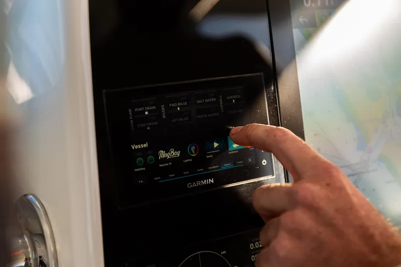 Slide: The Image of Touchscreen control panel on 2019 Mag Bay 33 CC boat, displaying vessel settings. - 82