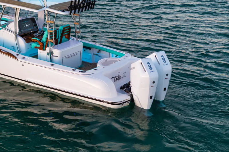 Slide: The Image of 2019 Mag Bay 33 CC boat with dual 400 V10 engines on water. - 9
