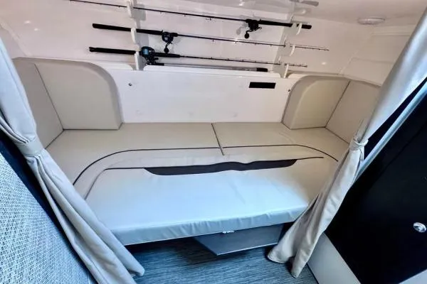Slide: The Image of 2022 Stamas 370 Aegean cabin interior with fishing rods and comfortable seating. - 11