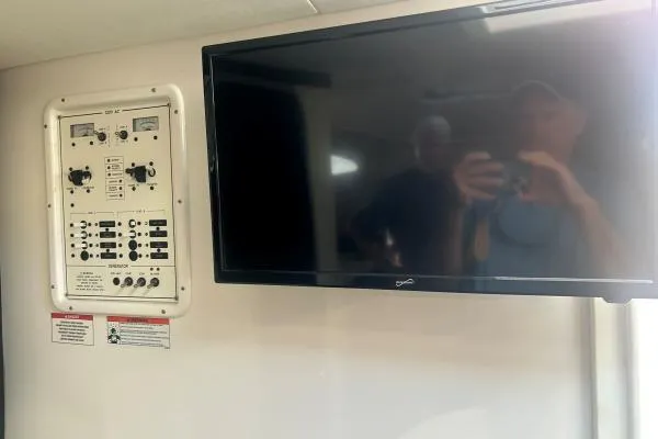 Slide: The Image of 2022 Stamas 370 Aegean interior with control panel and mounted TV. - 23